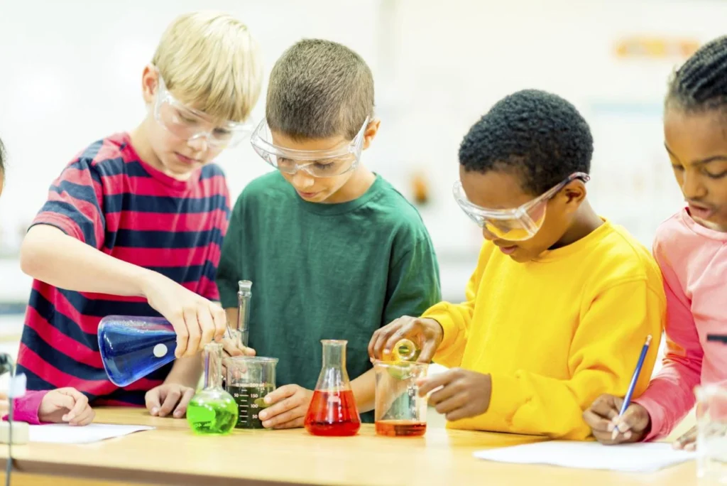 Primary school students performing a hands-on science experiment in the classroom