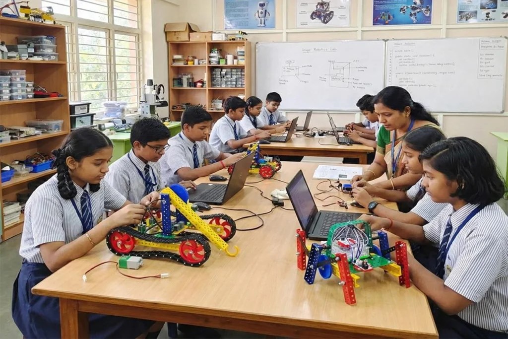 Students building a robotics project during a STEM Education and Future Skills classroom activity