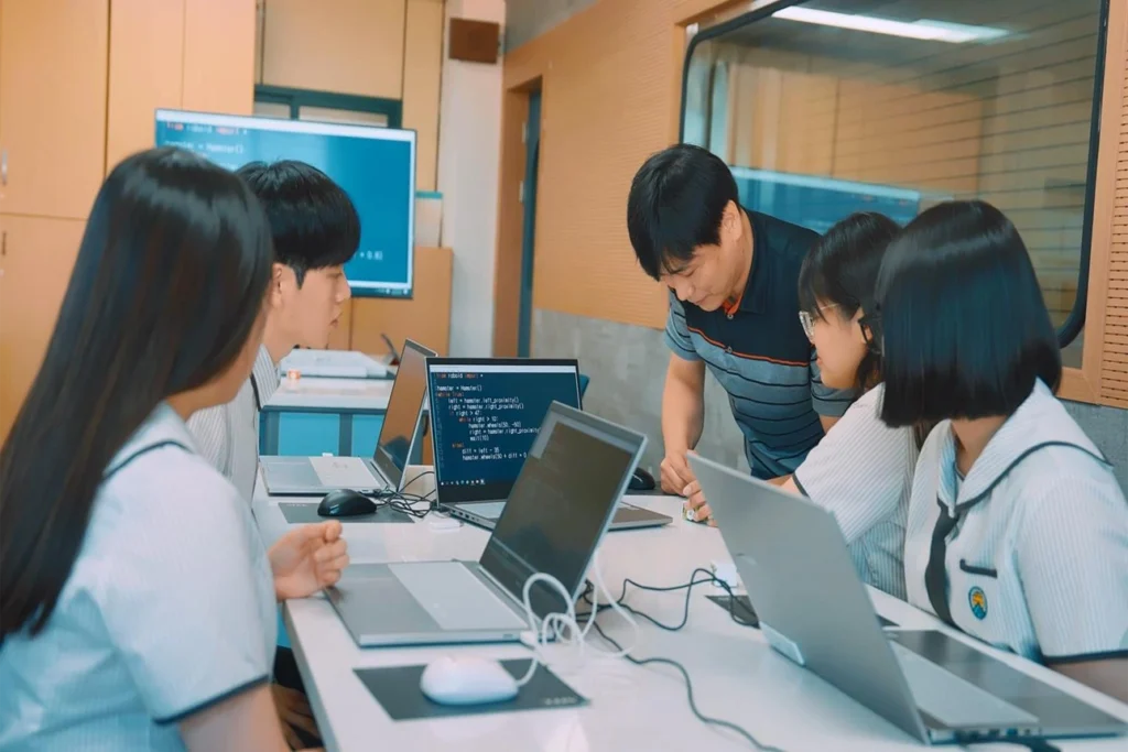 High school students learning coding and programming in a STEM laboratory
